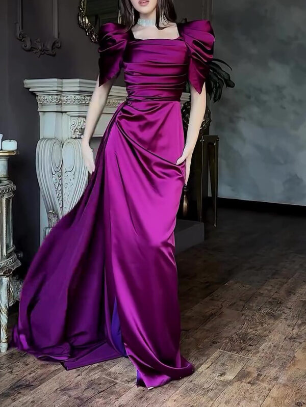 Elegant model wearing a stunning purple satin evening gown with puffed sleeves, showcasing a sophisticated style in a luxurious interior setting.