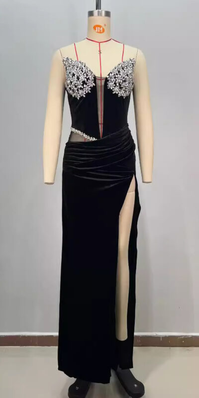 Elegant black evening gown displayed on a mannequin, featuring intricate beaded embellishments on the bodice and a thigh-high slit for a sophisticated look. Ideal for formal events and special occasions.