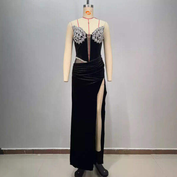 Elegant black evening gown displayed on a mannequin, featuring intricate beaded embellishments on the bodice and a thigh-high slit for a sophisticated look. Ideal for formal events and special occasions.