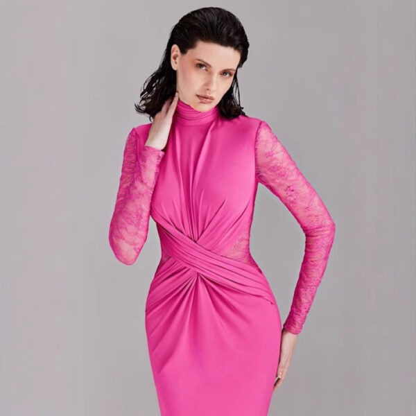 Model wearing a stylish pink dress with long lace sleeves and a fitted silhouette, showcasing a modern and elegant design. The dress features a high neckline and intricate draping details, perfect for formal occasions.