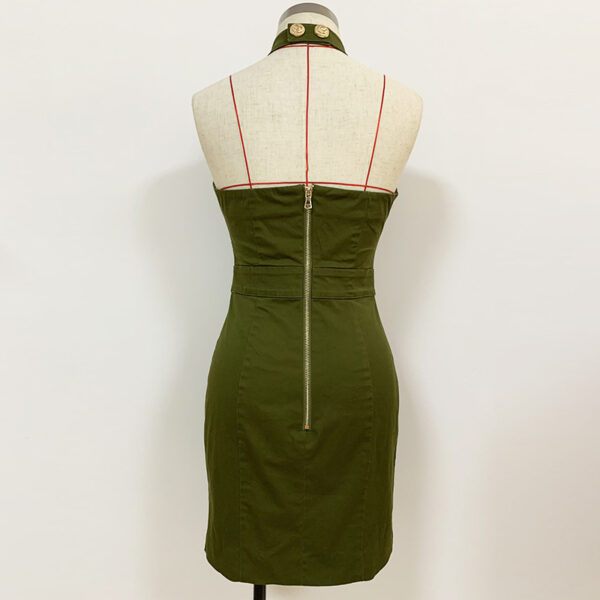 Back view of a stylish olive green fitted dress displayed on a mannequin, featuring a zip closure and a structured design with red accent lines. Perfect for modern fashion enthusiasts.