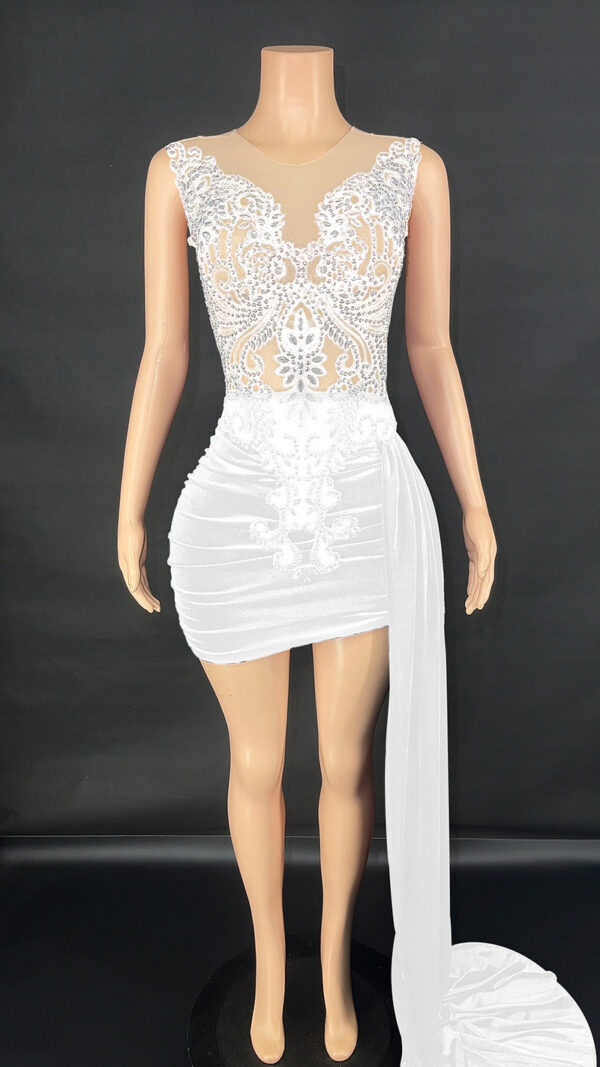 Elegant white dress with intricate lace and bead detailing, featuring a fitted bodice and a flowing skirt. Perfect for formal occasions or weddings. Displayed on a mannequin against a black background.