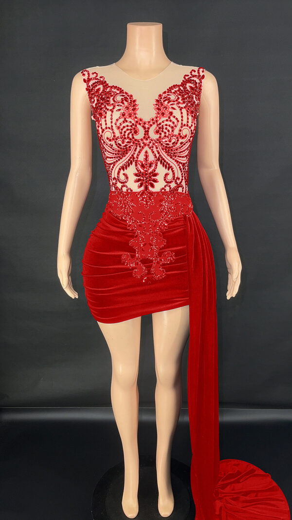 Elegant red evening dress displayed on a mannequin, featuring intricate beadwork and a fitted silhouette with a flowing side drape. Ideal for formal occasions and special events.