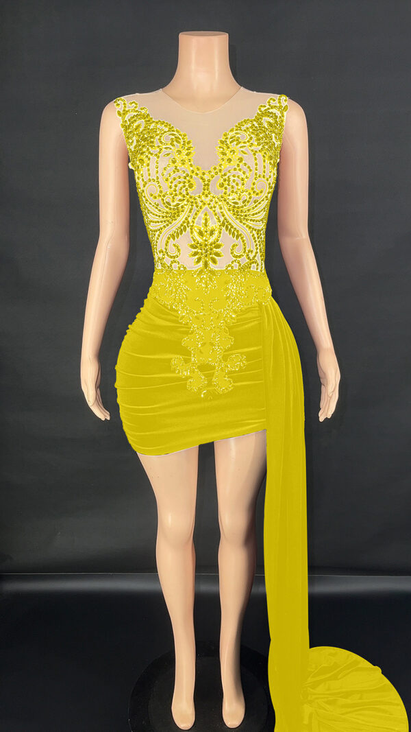 Elegant yellow evening dress featuring intricate beaded embellishments and a fitted silhouette, displayed on a mannequin against a black background. The dress has a sheer bodice and a flowing side drape, perfect for formal occasions.