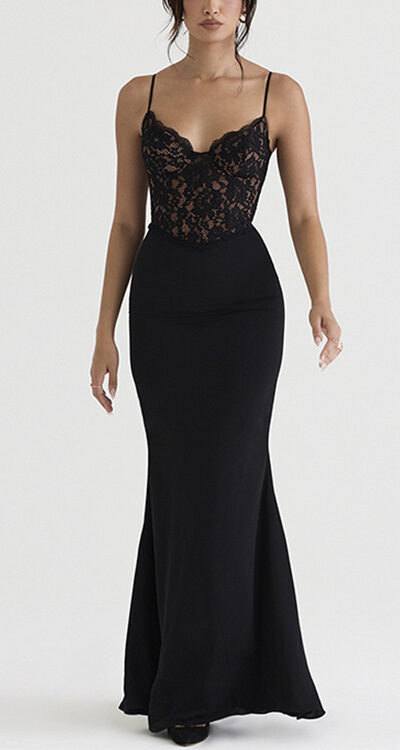 Elegant black lace and fitted satin evening dress with spaghetti straps, designed for formal occasions. The dress features a flattering silhouette that accentuates the figure, ideal for special events.