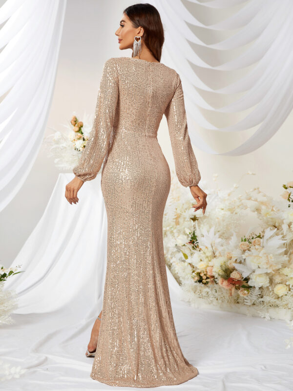 Elegant woman wearing a shimmering gold sequin evening gown, showcasing a fitted silhouette and long sleeves. The image captures her from the back, highlighting the dress's intricate detailing against a soft, floral backdrop. Perfect for formal events or special occasions.